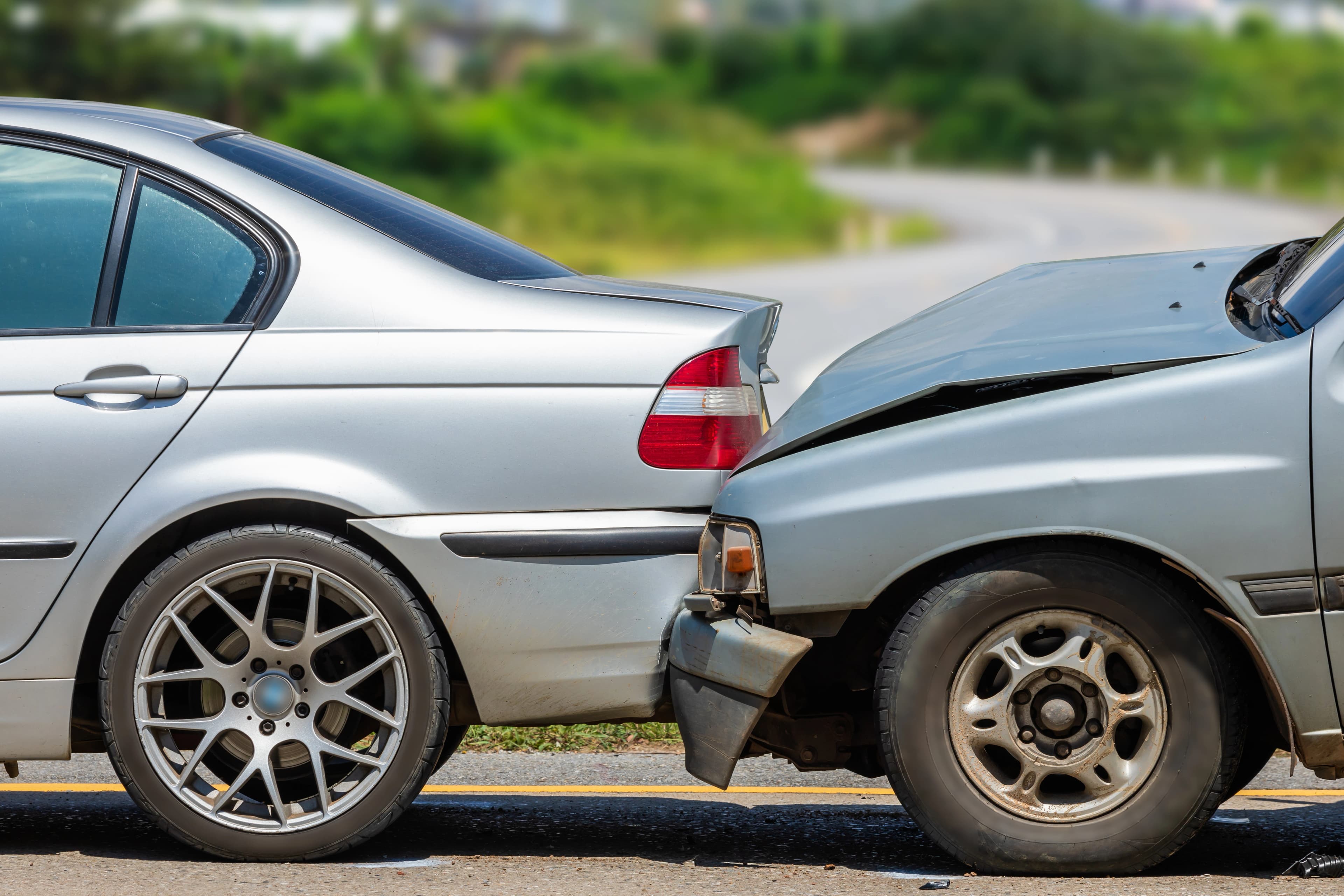 crashed cars on the side of the road